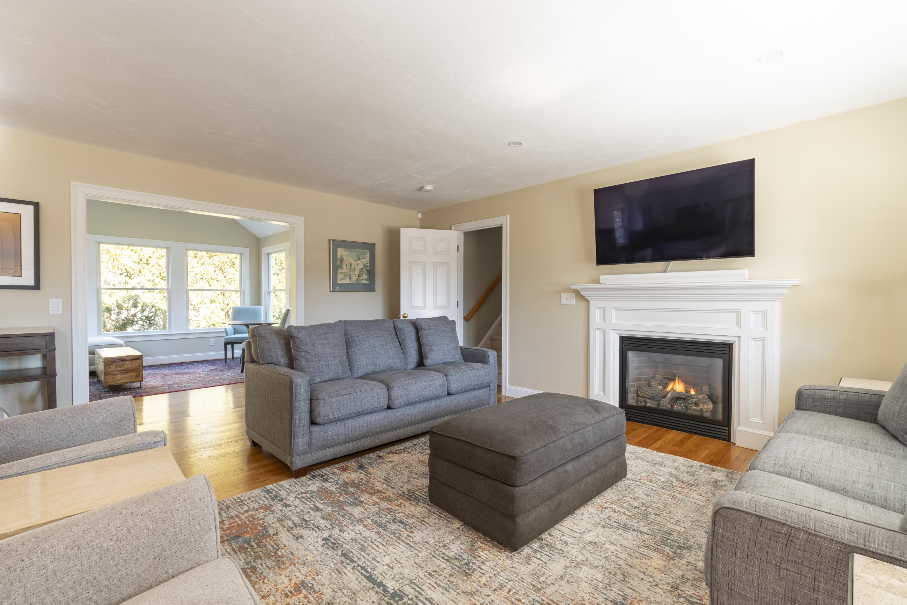 2 Parallel Street Harwich, MA 02645 - Photo 4 of 40 a living room with furniture flat screen tv and a fireplace