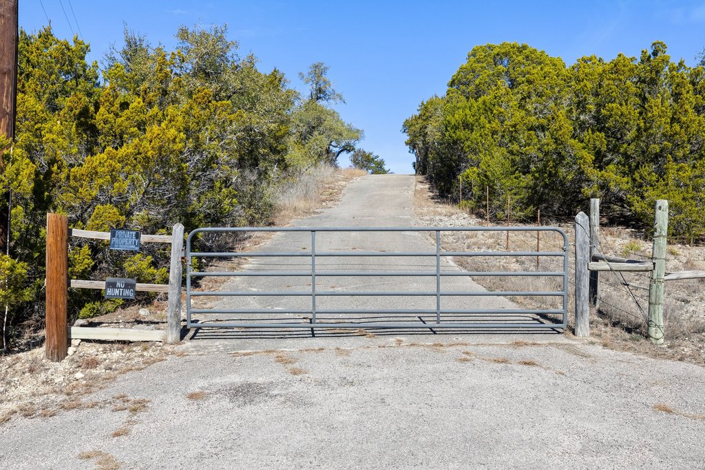 10904 Rawhide Trail Austin, TX 78736 - Photo 16 of 37 a view of a house with a yard