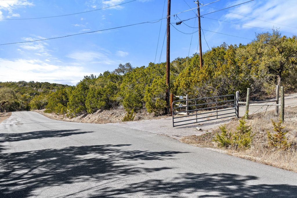 10904 Rawhide Trail Austin, TX 78736 - Photo 19 of 37 a backyard of a house with lots of green space