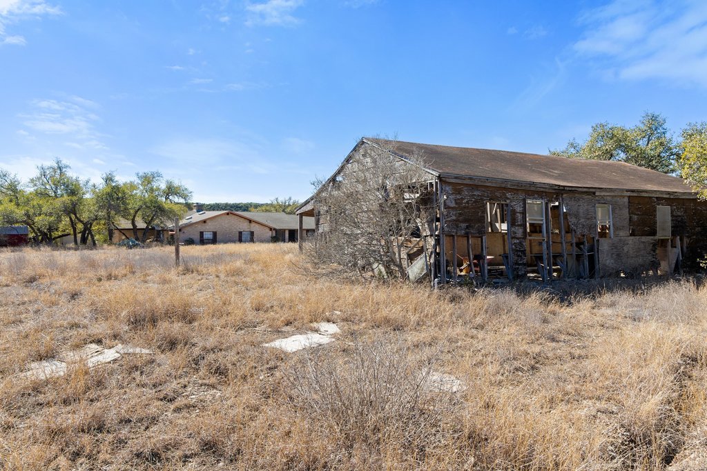 10904 Rawhide Trail Austin, TX 78736 - Photo 29 of 37 a view of a house with a yard