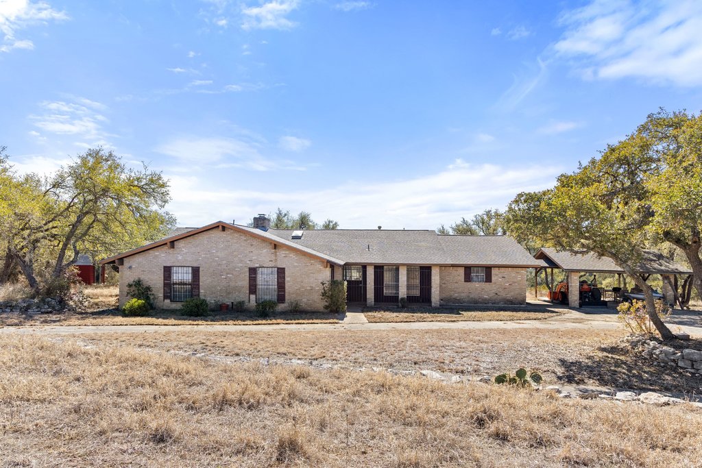10904 Rawhide Trail Austin, TX 78736 - Photo 9 of 37 a front view of house with yard covered in snow