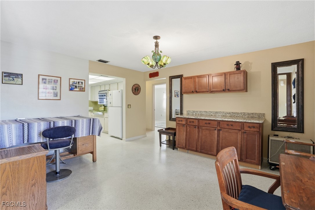 5541 Winkler Road Fort Myers, FL 33919 - Photo 13 of 22 a living room with furniture and a dining table