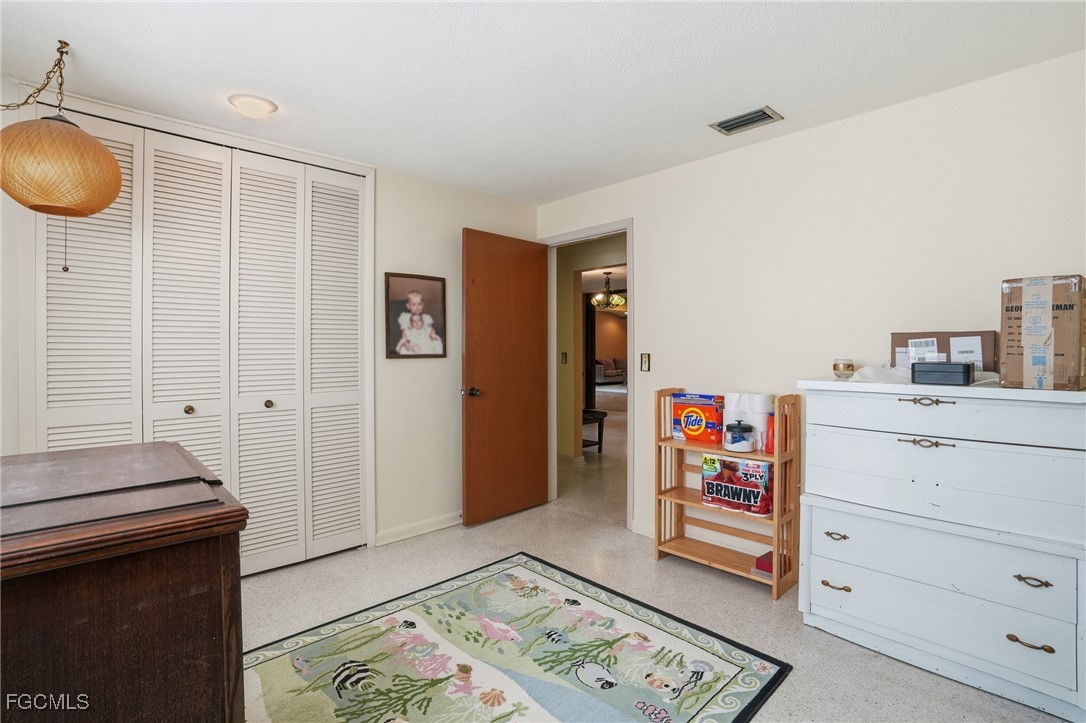 5541 Winkler Road Fort Myers, FL 33919 - Photo 14 of 22 a living room with furniture and a table