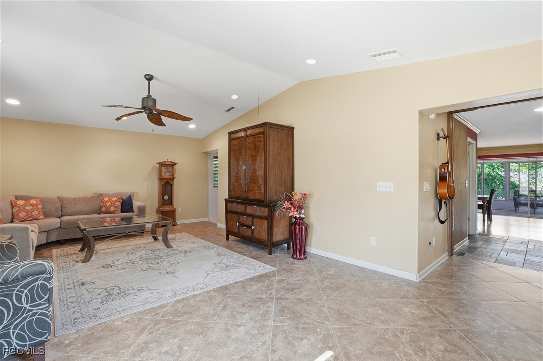 5541 Winkler Road Fort Myers, FL 33919 - Photo 2 of 22 a living room with furniture and a flat screen tv