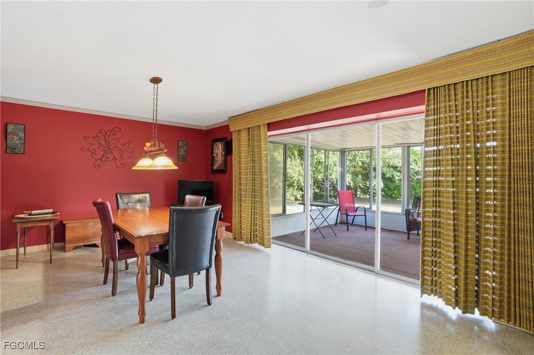 5541 Winkler Road Fort Myers, FL 33919 - Photo 8 of 22 a dining room with furniture and lamp floor to ceiling window and outside view