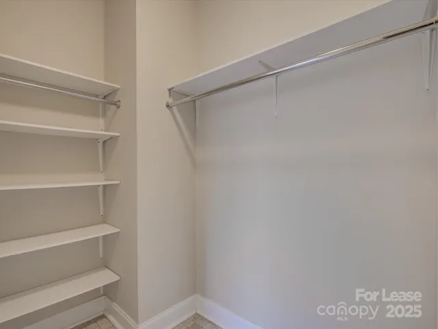 a view of an empty walk in closet