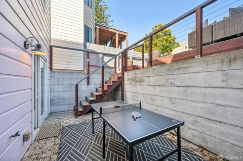 a view of a patio with couple of chairs