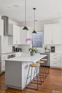 a dining room with furniture and wooden floor