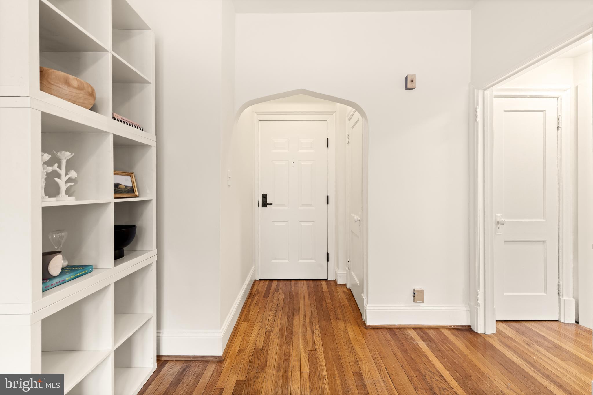 3446 Connecticut Avenue Northwest, Unit 401 Washington, DC 20008 - Photo 12 of 35 a view of a bedroom with wooden floor and closet
