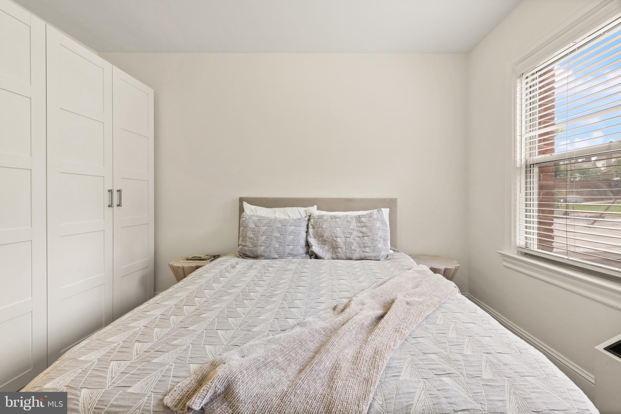 3446 Connecticut Avenue Northwest, Unit 401 Washington, DC 20008 - Photo 16 of 35 a bedroom with a bed and a window