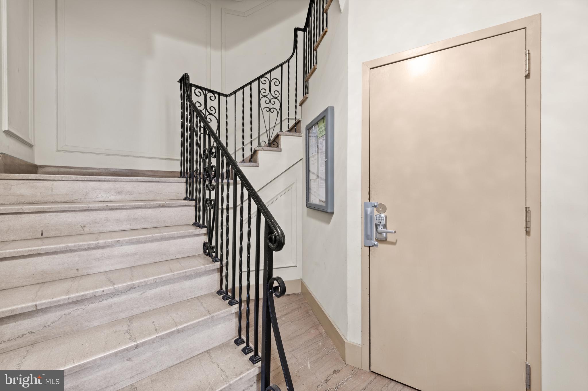 3446 Connecticut Avenue Northwest, Unit 401 Washington, DC 20008 - Photo 20 of 35 a view of staircase with wooden floor and white walls