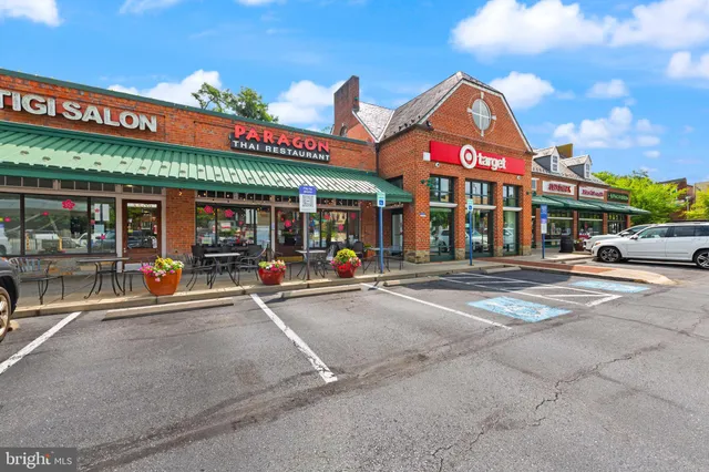 a view of a building with sitting area