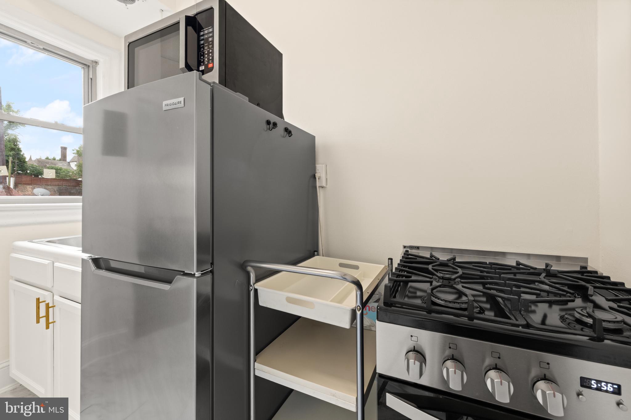 3446 Connecticut Avenue Northwest, Unit 401 Washington, DC 20008 - Photo 9 of 35 a kitchen with a stove and a refrigerator