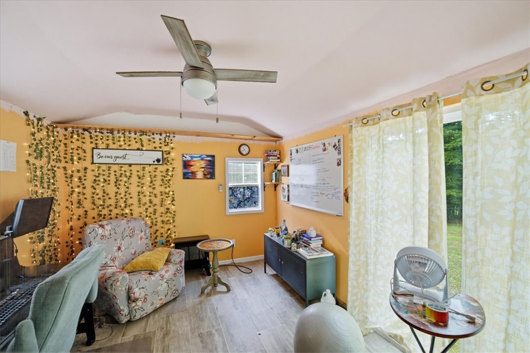 520 Sharon Lane Seneca, SC 29678 - Photo 40 of 48 Bright and airy, this versatile room features durable flooring and a refreshing ceiling fan.