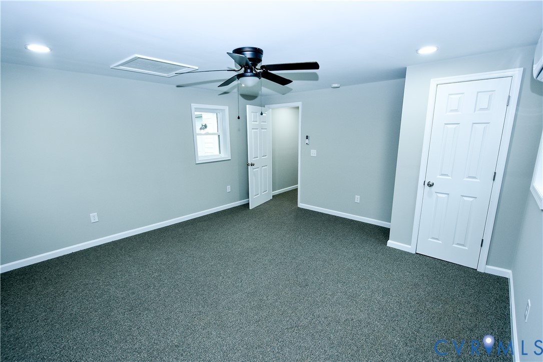 416 South Virginia Street Farmville, VA 23901 - Photo 14 of 33 an empty room with a ceiling fan and window
