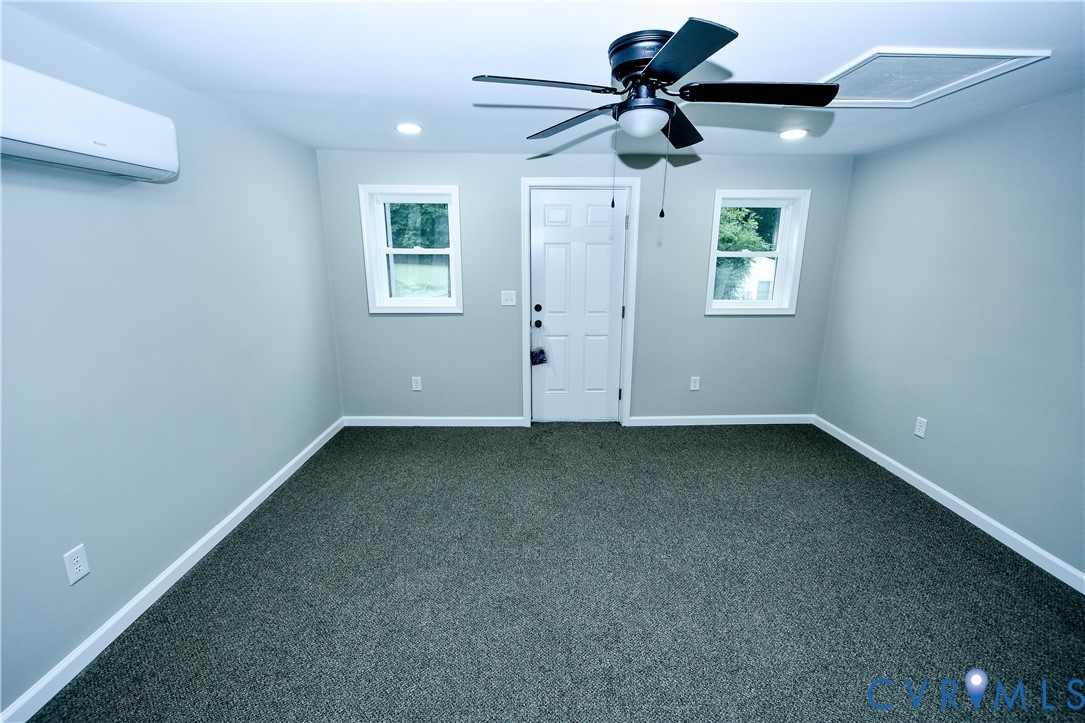 416 South Virginia Street Farmville, VA 23901 - Photo 19 of 33 an empty room with a ceiling fan and window