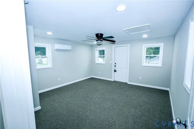 a view of empty room with windows