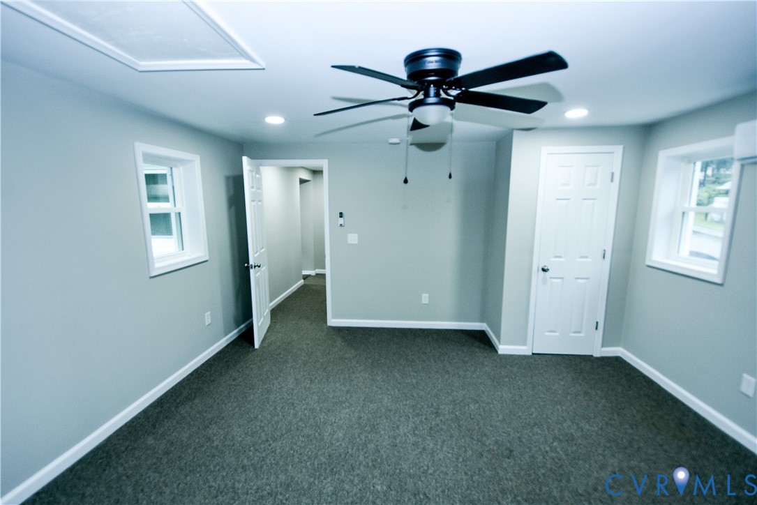 416 South Virginia Street Farmville, VA 23901 - Photo 26 of 33 a view of a livingroom with a ceiling fan & windows