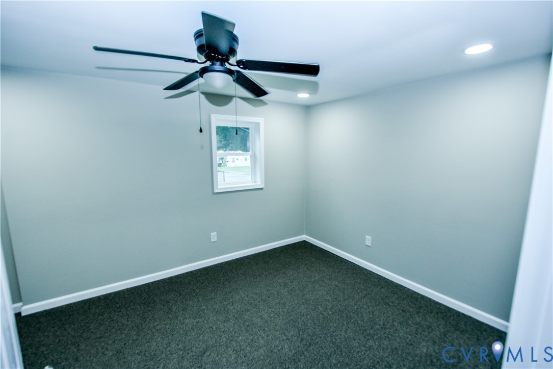 416 South Virginia Street Farmville, VA 23901 - Photo 27 of 33 en empty room with a window and a fan