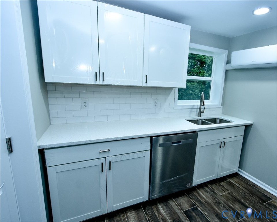 416 South Virginia Street Farmville, VA 23901 - Photo 6 of 33 a kitchen with granite countertop white cabinets and sink