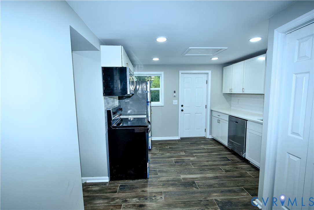 416 South Virginia Street Farmville, VA 23901 - Photo 10 of 33 a kitchen with a refrigerator and a stove top oven