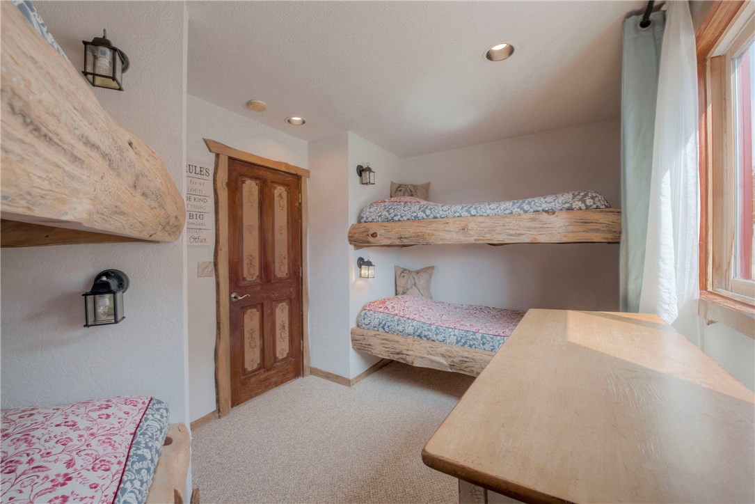9460 Ryan Gulch Road, Unit 60 Silverthorne, CO 80498 - Photo 21 of 34 Bunk room in lower level