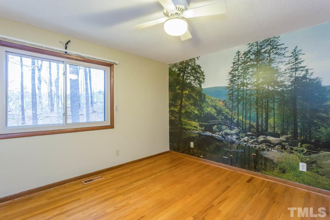 6701 Laurdane Road Raleigh, NC 27613 - Photo 14 of 24 a view of an empty room with a window