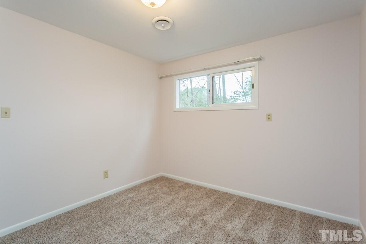 6701 Laurdane Road Raleigh, NC 27613 - Photo 20 of 24 an empty room with a window