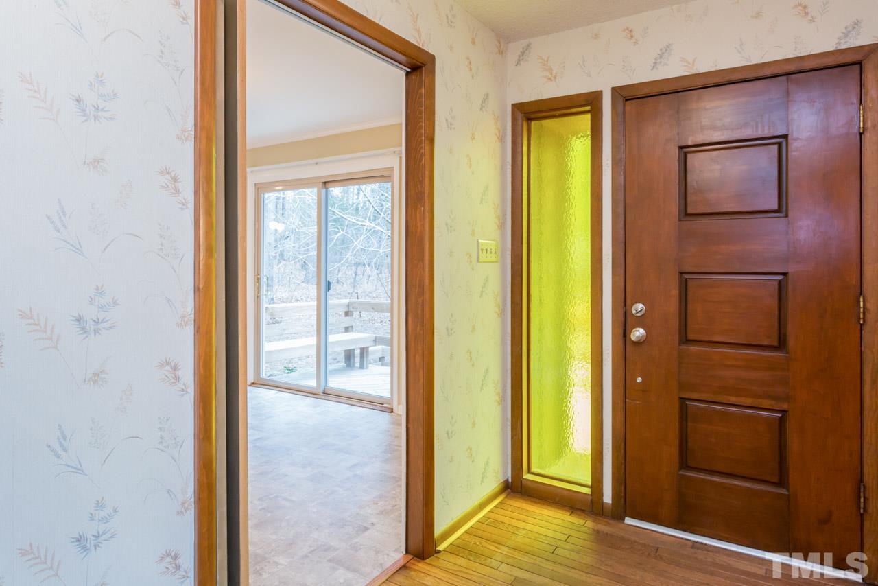 6701 Laurdane Road Raleigh, NC 27613 - Photo 3 of 24 a view of a bathroom with a glass door