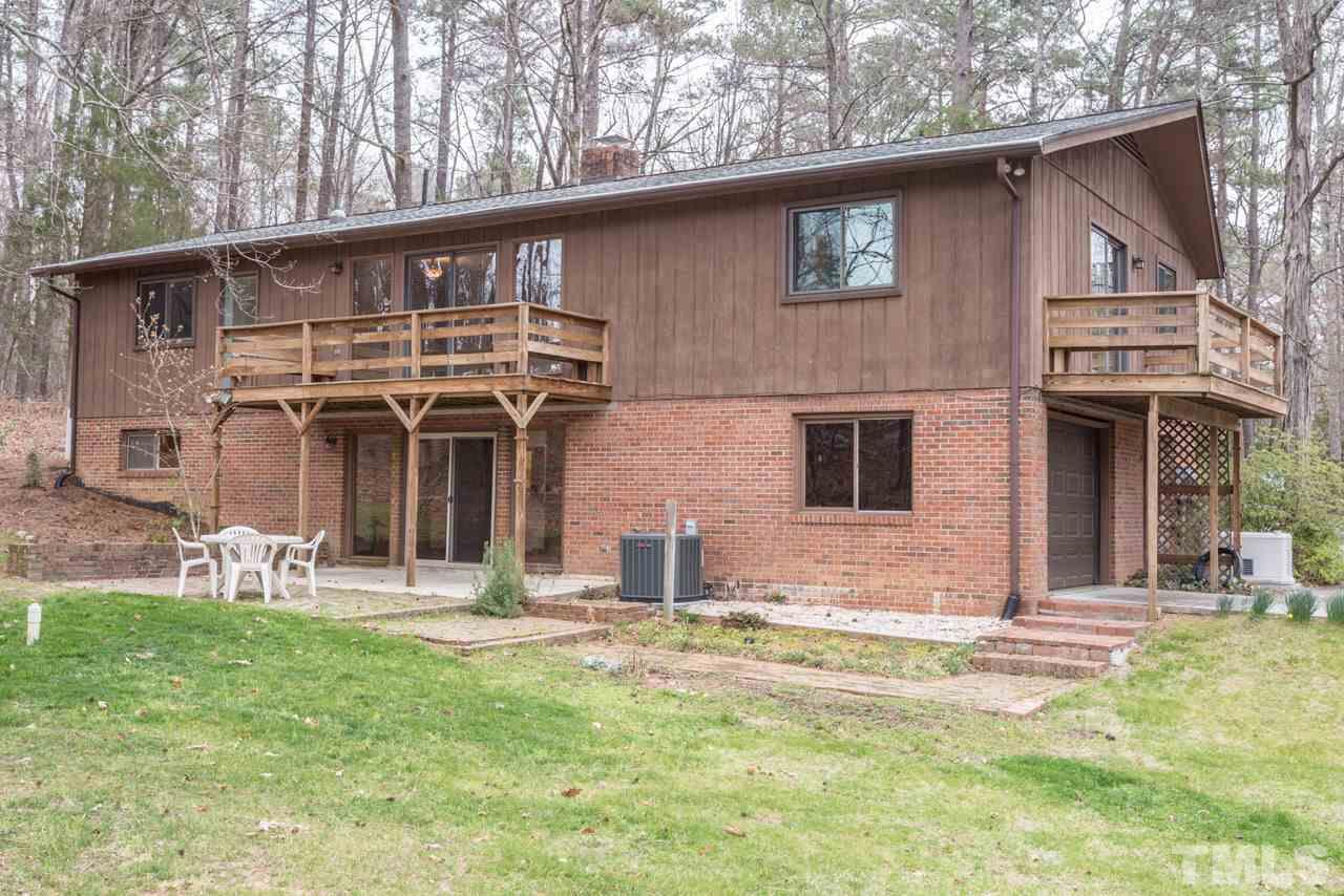 6701 Laurdane Road Raleigh, NC 27613 - Photo 22 of 24 a front view of a house with garden