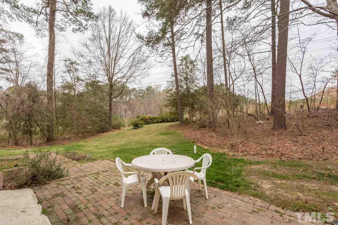 6701 Laurdane Road Raleigh, NC 27613 - Photo 23 of 24 a view of a table and chairs in backyard