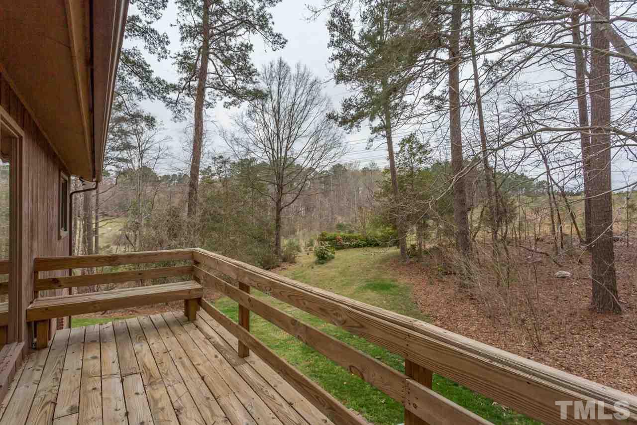 6701 Laurdane Road Raleigh, NC 27613 - Photo 9 of 24 a view of backyard with wooden floor and outdoor seating