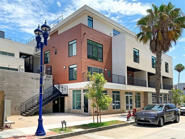 a front view of a building with street view
