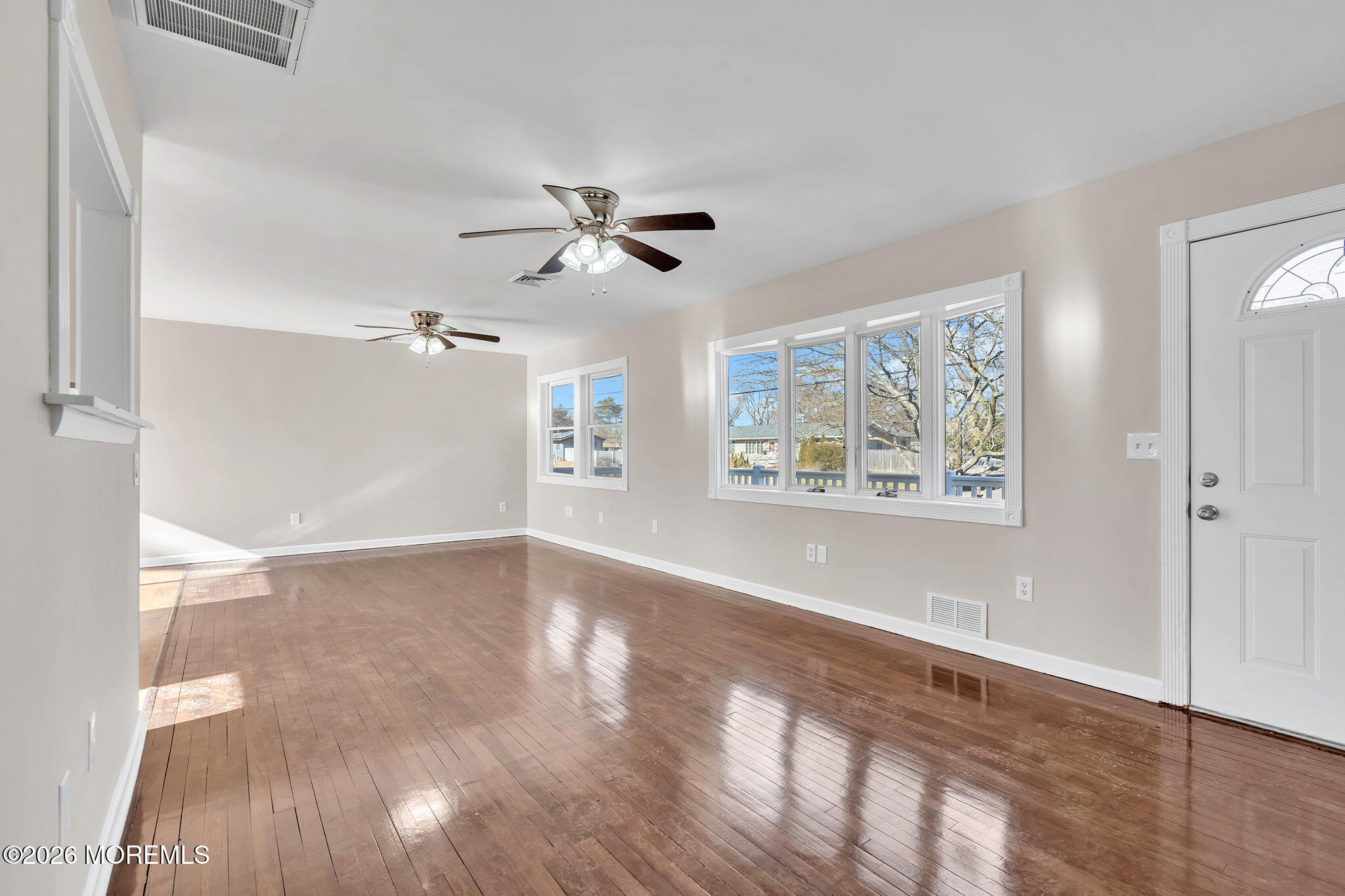 34 Dockage Road Bayville, NJ 08721 - Photo 13 of 31 a view of empty room with wooden floor and fan