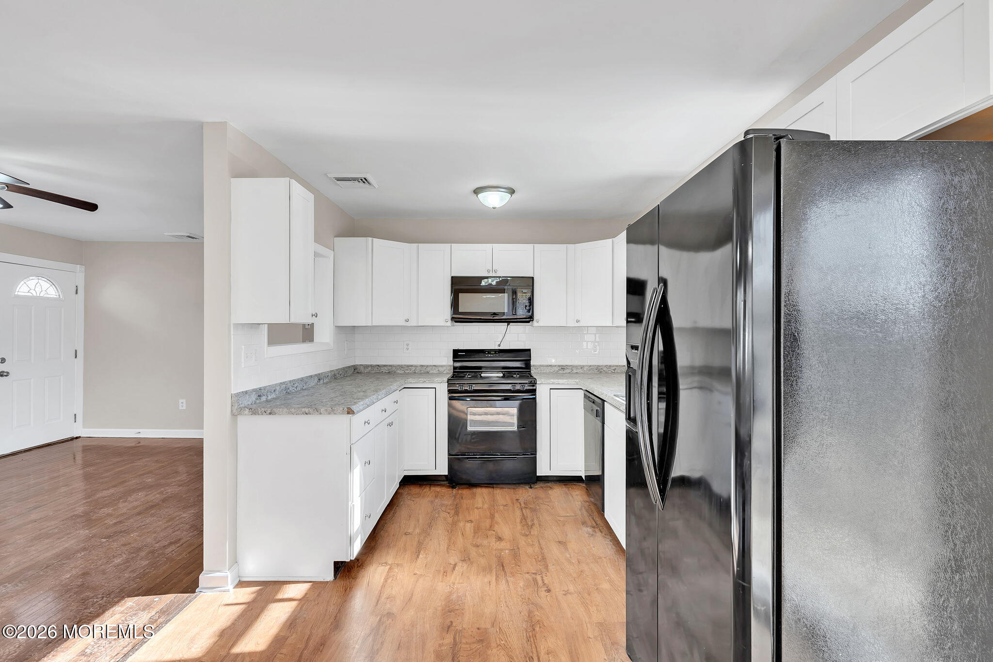 34 Dockage Road Bayville, NJ 08721 - Photo 18 of 31 a kitchen with stainless steel appliances granite countertop a refrigerator and a stove top oven