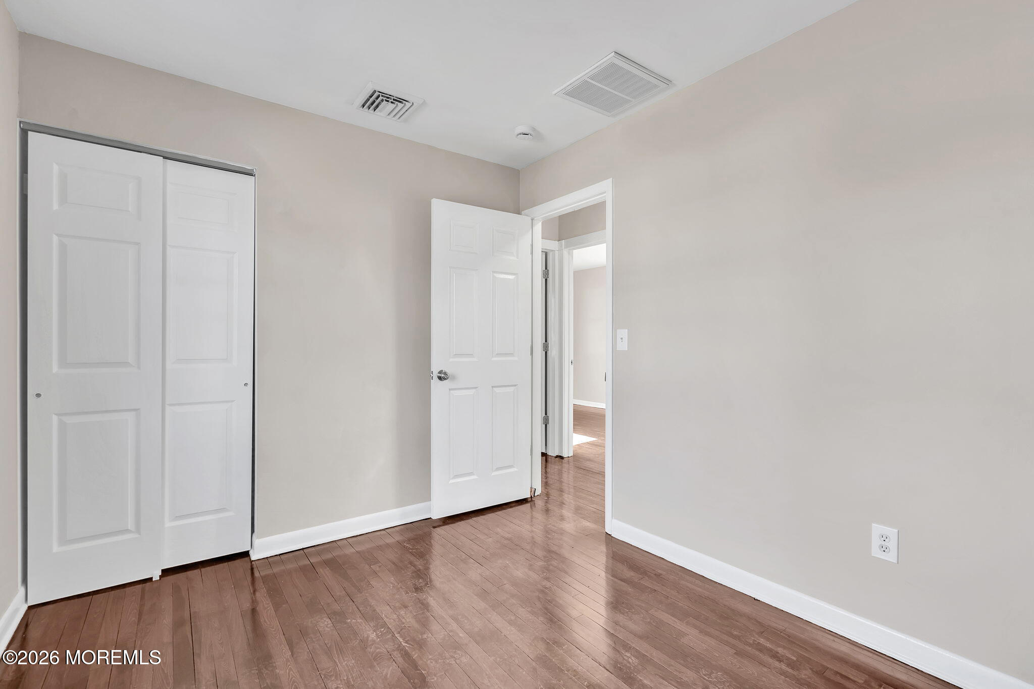 34 Dockage Road Bayville, NJ 08721 - Photo 27 of 31 a view of an empty room and wooden floor
