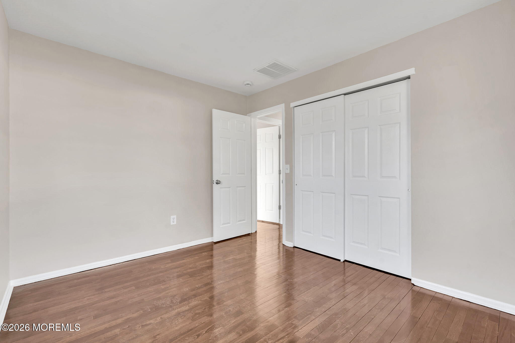 34 Dockage Road Bayville, NJ 08721 - Photo 29 of 31 a view of an empty room with wooden floor