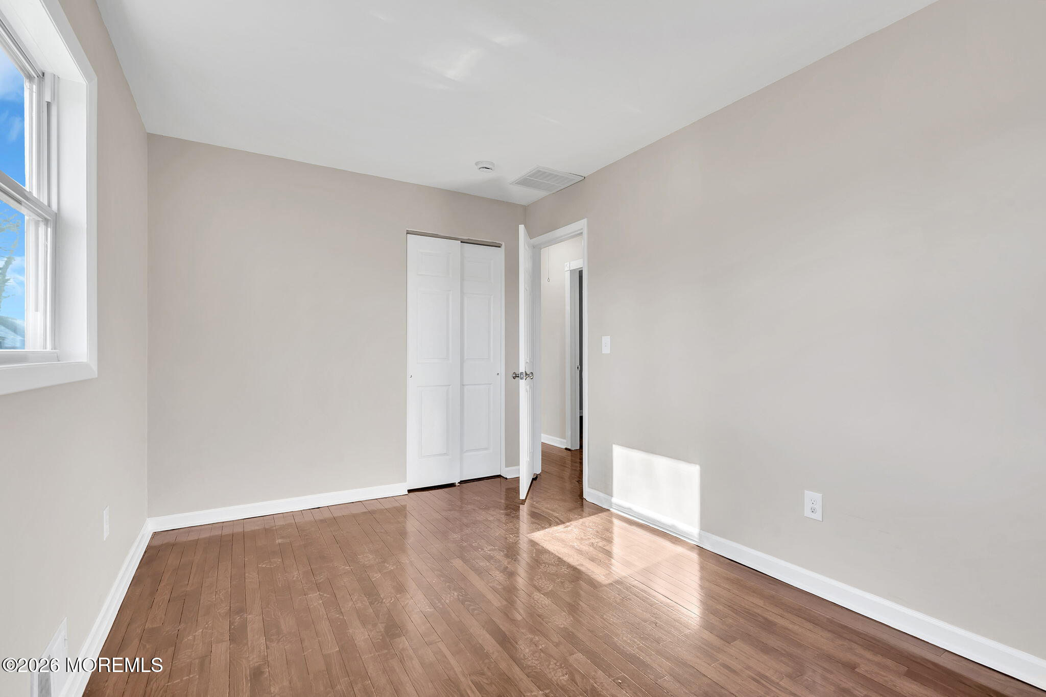 34 Dockage Road Bayville, NJ 08721 - Photo 31 of 31 a view of an empty room with wooden floor