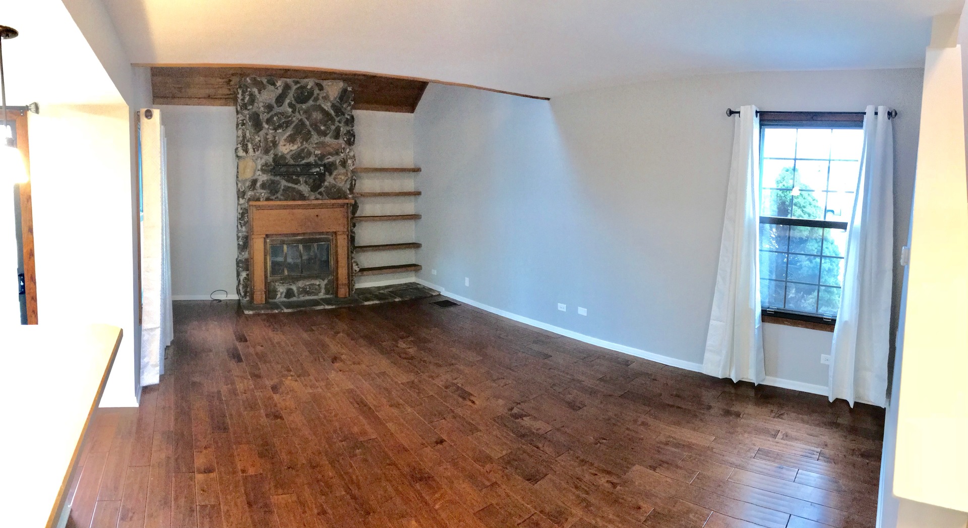 738 Chandler Road, Unit 738 Gurnee, IL 60031 - Photo 3 of 24 an empty room with wooden floor closet and windows