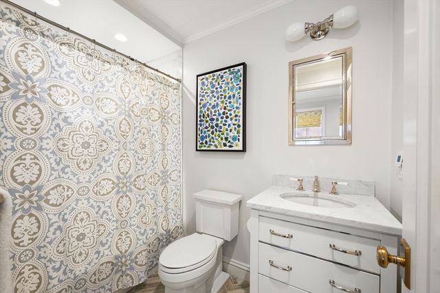 a view of a brick house with many windows