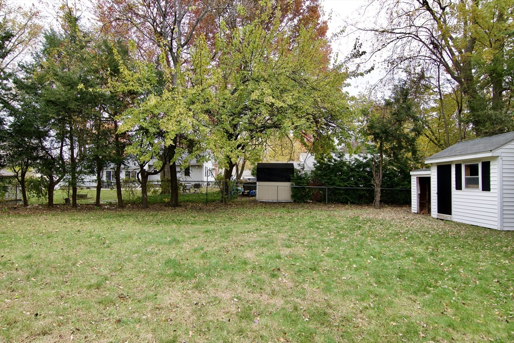 77 West Allen Ridge Road Springfield, MA 01118 - Photo 3 of 42 a house with trees in front of it