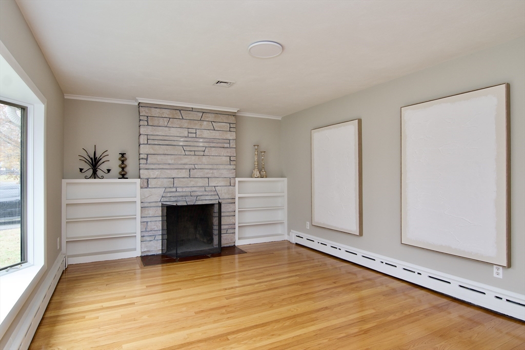 77 West Allen Ridge Road Springfield, MA 01118 - Photo 4 of 42 a view of an empty room with a fireplace and a window