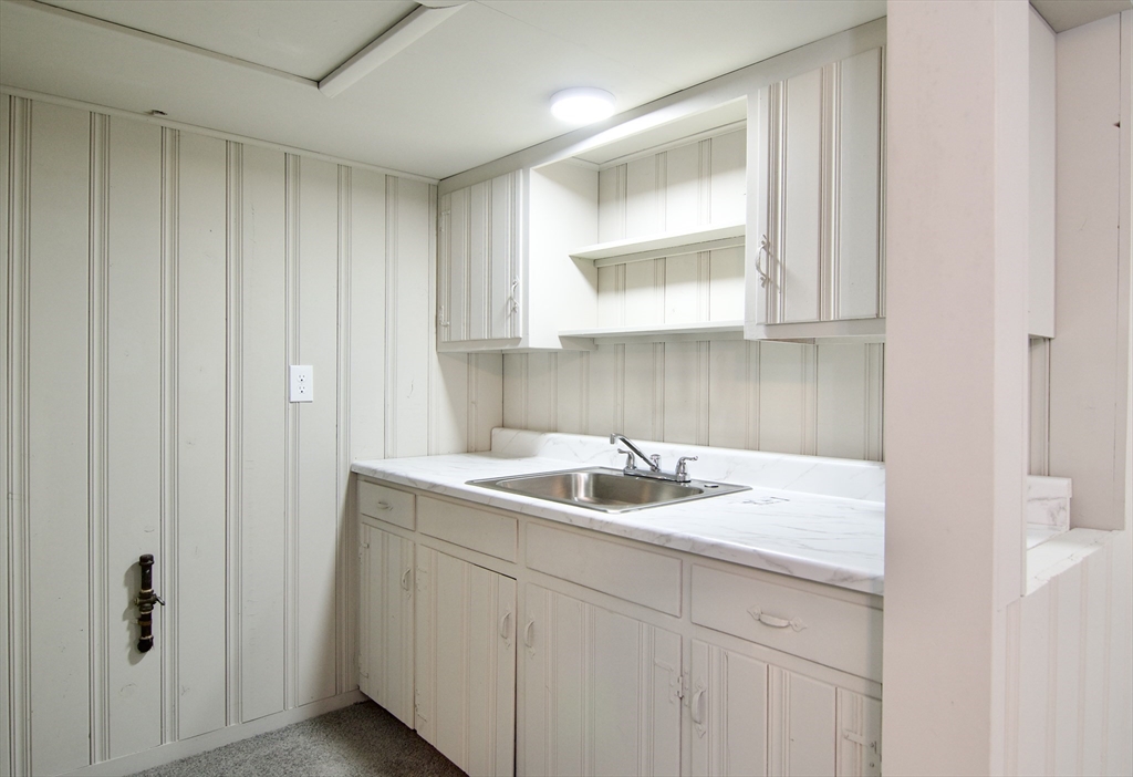 77 West Allen Ridge Road Springfield, MA 01118 - Photo 41 of 42 a kitchen with a sink and cabinets