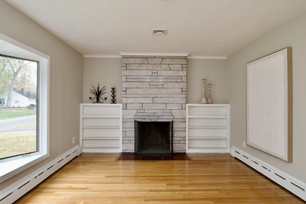 77 West Allen Ridge Road Springfield, MA 01118 - Photo 5 of 42 a view of an empty room with a fireplace and a window