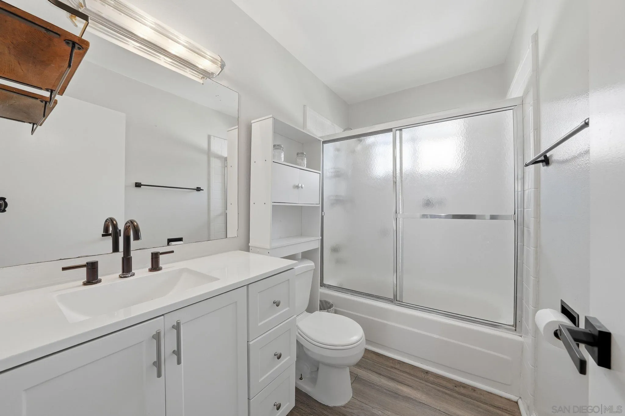 9926 Mission Vega Road, Unit 4 Santee, CA 92071 - Photo 21 of 30 a bathroom with a sink a toilet and shower