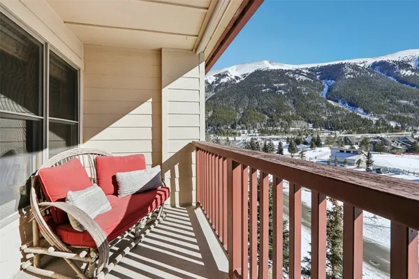 a balcony view with couple of chairs
