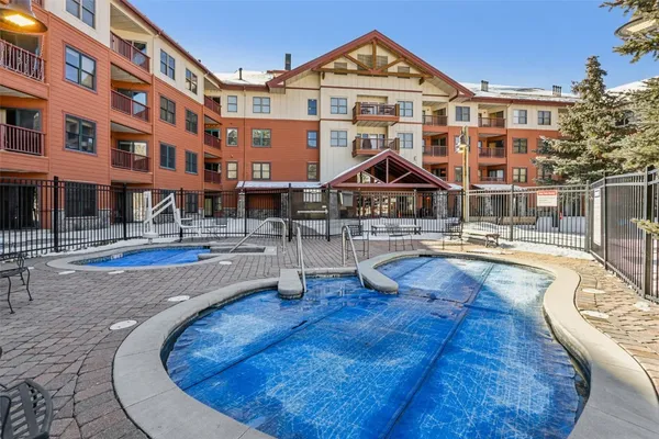 a swimming pool with outdoor seating