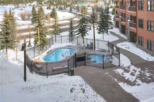 a view of a backyard with sitting area