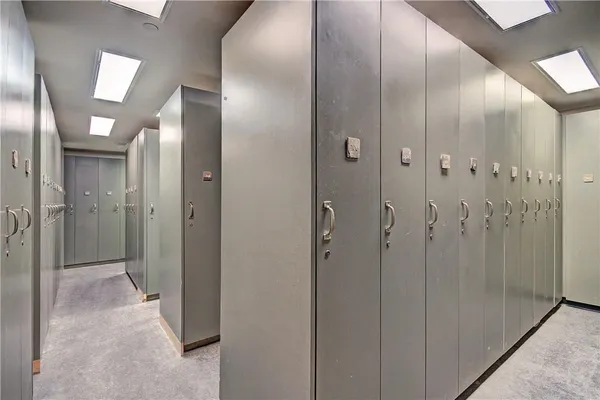 a bathroom with a glass shower door