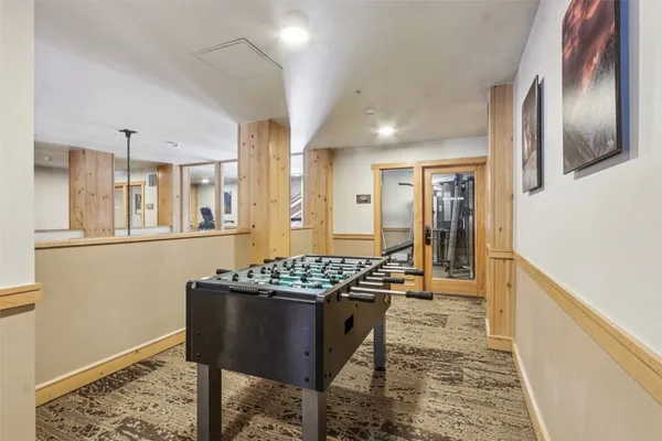 a kitchen with stainless steel appliances granite countertop a stove a refrigerator and a wooden cabinets